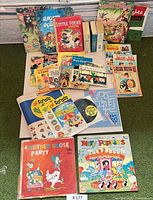 Overview of entire lot displaying books, magazines and record albums