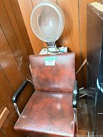 Front view of Beauty Aid salon chair with integrated hood dryer showing overall form and components