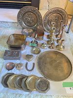 Group shot of entire lot displaying plates, tray, candlesticks, coasters, boxes, dishes, figurine