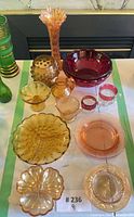 Entire lot showing all nine glass pieces within green-taped area