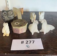 group of animal figurines, trinket box and grey carved container
