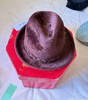 Fedora on red Biltmore box