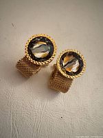 Front view showing rhinestone faces and mesh bands