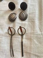 All three earring pairs laid out on cloth