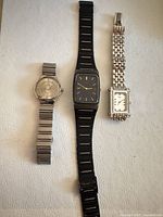 Overview of all three wristwatches laid out side by side