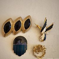All four brooches arranged on surface