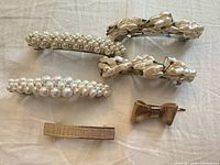 All six hair clips laid out showing designs