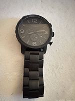 Front view of Fossil Nate chronograph watch showing dial, bezel, bracelet