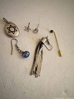 All six jewellery pieces laid out