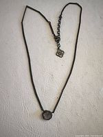 Full view of necklace showing chain, pendant, extender