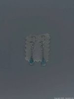 Front view of larimar drop earrings on display card