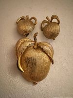 Front view showing brooch and matching earrings