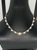 Front view showing faux pearls and rhinestones on collar necklace