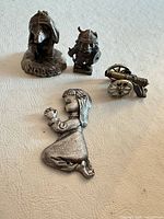 Group shot of the four pewter miniatures