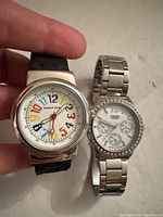 Front view of both watches side by side