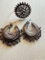 Overview showing both earrings and filigree ring