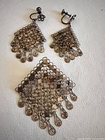Full view of pendant and both earrings