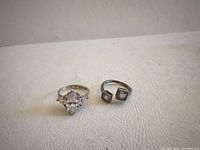 Two sterling silver rings side by side