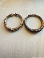 Both sterling silver bracelets side by side showing overall form