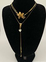 Both necklaces displayed on bust to show overall length and style