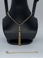Full view of both necklaces showing design and size relation