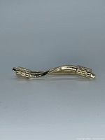 Front view of gold tone belt decoration clasp