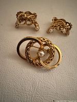 Front view of brooch and both earrings