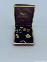 Closed Eaton’s 14kt gold jewelry box showing contents