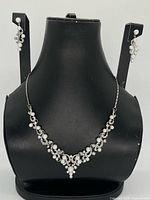 Full set on display showing necklace and earrings