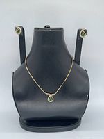Full set on display bust showing necklace and earrings