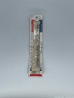 Front of sealed package showing Mor-Flex watch band