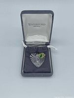 Pendant in open presentation box showing overall lot and Waterford branding