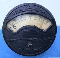 Front view showing dial, scale, maker, condition