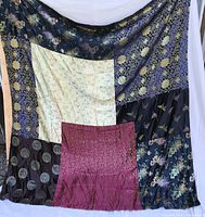 Full view of patchwork quilt hung vertically