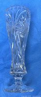 Full view of clear crystal pedestal vase with cut pinwheel pattern