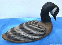 profile of painted wooden Canada goose decoy