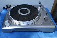 Top view of ION iTTUSB turntable showing platter, tonearm, controls, cables