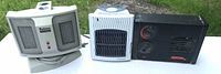 All three electric ceramic space heaters side by side on table