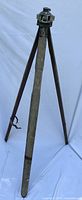 Full view of tripod standing on three legs