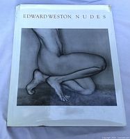 Front view of Edward Weston Nudes hardcover book with dust jacket showing wear