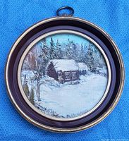 Full view of circular framed acrylic painting