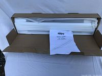 Heater in open box with user manual visible