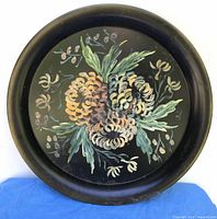 Front view showing floral painting and overall design
