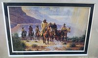 Close view of cowboy artwork and matting