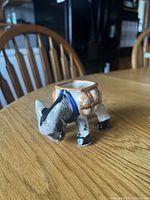 front three-quarter view of glazed ceramic donkey holder