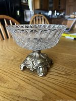 Full view of crystal compote dish on brass base