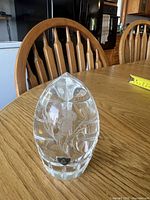 Front view showing etched thistle design on crystal paperweight