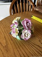 Front view of bone china floral posy showing pink roses and yellow carnations