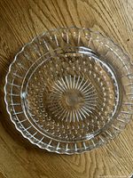 Top view showing full plate, bubble pattern, sunburst centre, scalloped edge