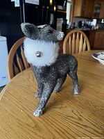Side view of small glitter deer showing faux fur collar and bell